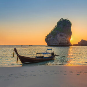 Traditional thai longtail boat at sunset Nui Bay Beach, Thailand Traditional thai longtail boat at sunset Nui Bay Beach, Thailand